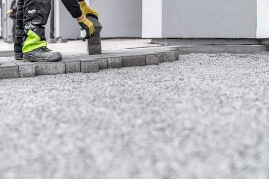 construction of a sidewalk from concrete blocks.