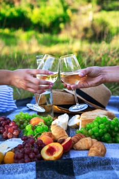 couple in love drinking white wine on a picnic. Selective focus. nature