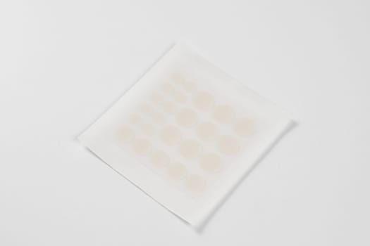 Set of round acne patches on white background. Close-up acne patch facial rejuvenation. Facial cleansing cosmetology
