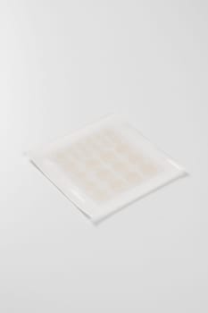 Set of round acne patches on white background. Close-up acne patch facial rejuvenation. Facial cleansing cosmetology