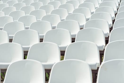 Seats of tribune on sport stadium. Concept of fans, chairs for audience, cultural environment concept. mpty seats, modern stadium