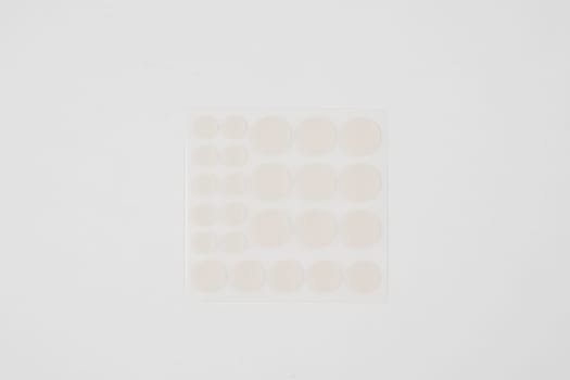 Set of round patches for acne on white background. Acne patches for the treatment of pimple and rosacea close-up. Facial rejuvenation cleansing cosmetology