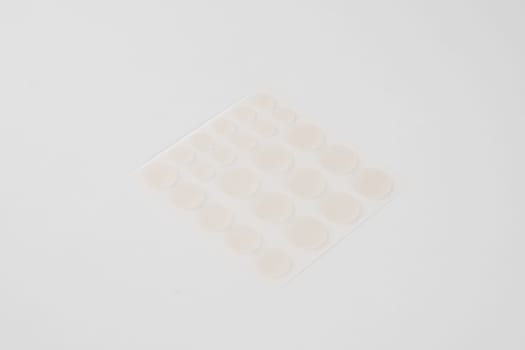 Set of round patches for acne on white background. Acne patches for the treatment of pimple and rosacea close-up. Facial rejuvenation cleansing cosmetology