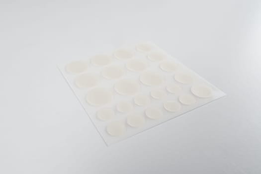 Set of round patches for acne on white background. Acne patches for the treatment of pimple and rosacea close-up. Facial rejuvenation cleansing cosmetology