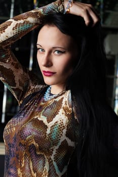 Portrait of young brunette woman in nightclub