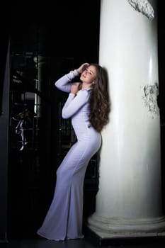 Full length portrait of beautiful and fashion woman in gold dress