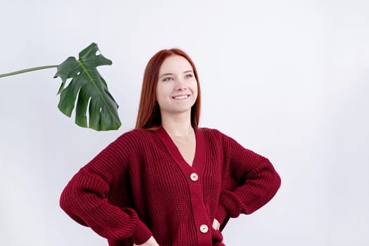 portrait of a happy young beautiful woman in red clothes posing on white background, copy space