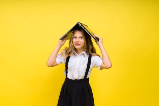 Little happy blonde kid girl 12-13 years laptop computer. Children lifestyle childhood concept.