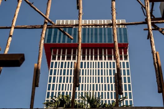 Temporary wooden pole for supports the concrete structure a building under construction