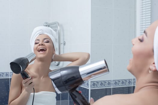 Portrait of happy young woman singing in bathroom
