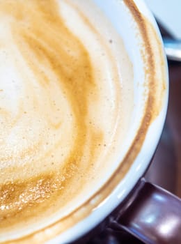 Texture surface of soft and delicate milk froth in a cup of coffee