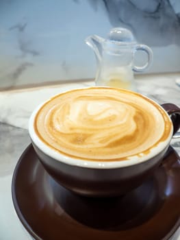 Texture surface of soft and delicate milk froth in a cup of coffee