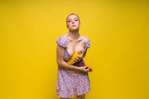 Young classic pin-up woman painting wall with a paint roller