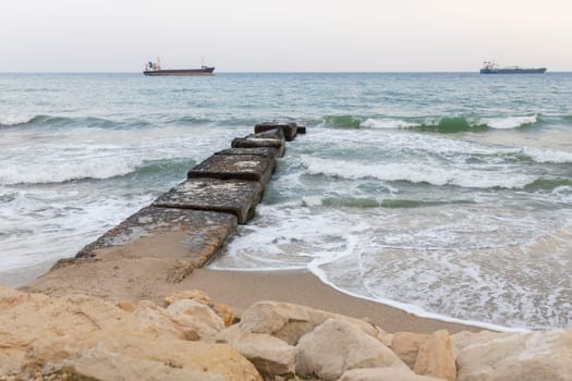 The beautiful coast of the city of Varna in Bulgaria. The sea beats against the stones, amazing seascape.