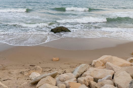 The beautiful coast of the city of Varna in Bulgaria. The sea beats against the stones, amazing seascape.