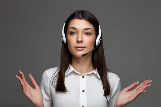 friendly woman with headset is consulting clients online. Call center, business people concept