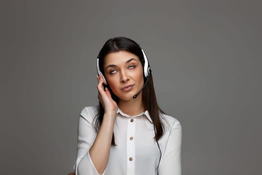 tired upset frustrated female call center agent is consulting clients online. Call center, business people concept