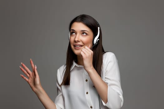 happy woman with headset is consulting clients online. Call center