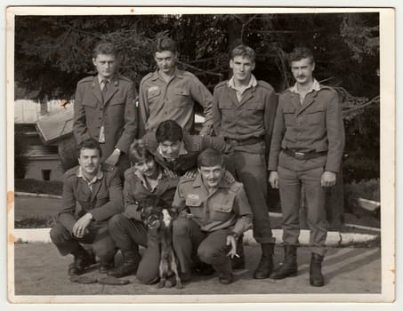 THE CZECHOSLOVAK SOCIALIST REPUBLIC - CIRCA 1980s: Retro photo shows soldiers pose outdoors. Black andwhite vintage photography.