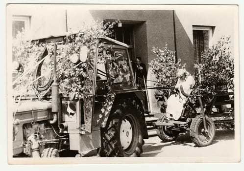 THE CZECHOSLOVAK SOCIALIST REPUBLIC - CIRCA 1970s: Retro photo shows bride rides on rural wedding celebration. Black and white vintage photography.