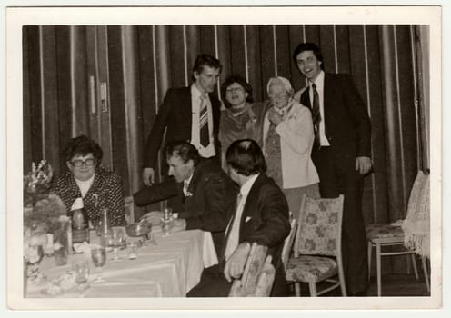 THE CZECHOSLOVAK SOCIALIST REPUBLIC - CIRCA 1970s: Retro photo shows people during wedding celebration. Black and white vintage photography.