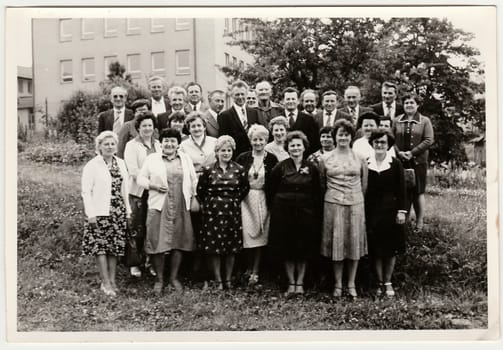 THE CZECHOSLOVAK SOCIALIST REPUBLIC - CIRCA 1970s: Retro photo shows group of people pose outdoors. Black and white vintage photography.