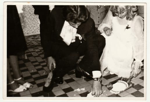 THE CZECHOSLOVAK SOCIALIST REPUBLIC - CIRCA 1970s: Retro photo shows people on wedding celebration. Black and white vintage photography.