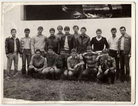 THE CZECHOSLOVAK SOCIALIST REPUBLIC - CIRCA 1970s: Retro photo shows men pose outdoors. Black and white vintage photography.