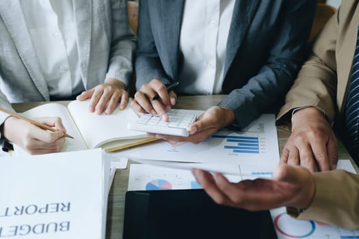 Asian entrepreneurs and business people meeting in a conference room in business planning, financial budget and investment risk assessment to analyze customer groups to increase company growth.