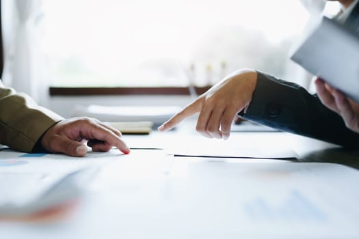 Asian entrepreneurs and business people meeting in a conference room in business planning, financial budget and investment risk assessment to analyze customer groups to increase company growth.