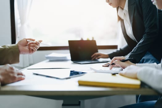 Asian entrepreneurs and business people meeting in a conference room in business planning, financial budget and investment risk assessment to analyze customer groups to increase company growth.