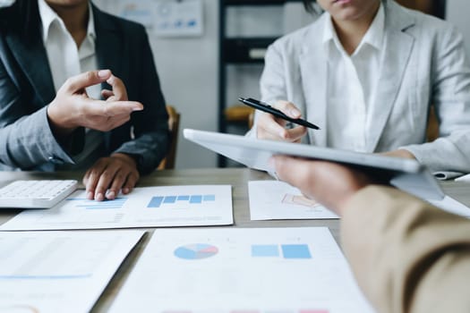 Asian entrepreneurs and business people meeting in a conference room in business planning, financial budget and investment risk assessment to analyze customer groups to increase company growth.