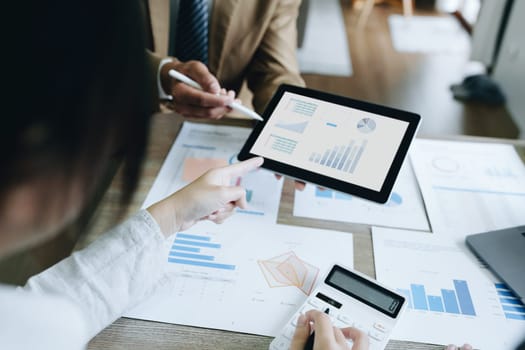 Asian entrepreneurs and business people meeting in a conference room in business planning, financial budget and investment risk assessment to analyze customer groups to increase company growth.