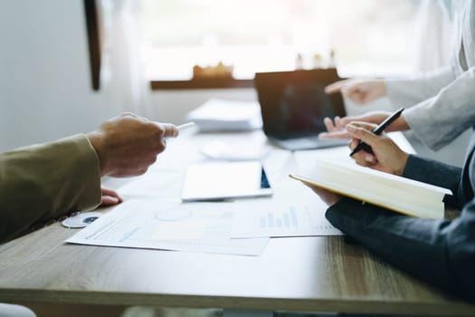 Asian entrepreneurs and business people meeting in a conference room in business planning, financial budget and investment risk assessment to analyze customer groups to increase company growth.