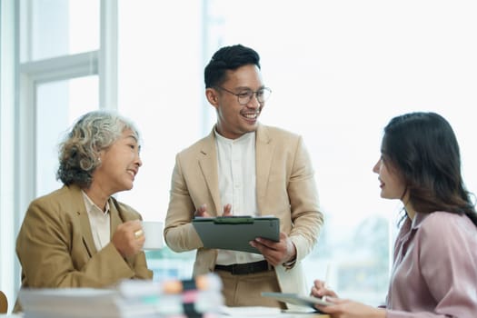 Asian entrepreneurs and business people meeting in a conference room in business planning, financial budget and investment risk assessment to analyze customer groups to increase company growth.