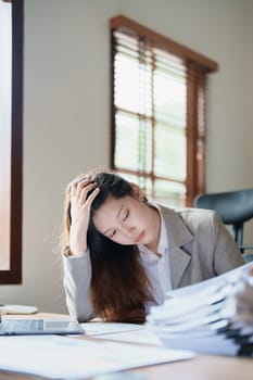 Portrait of sme business owner, man using computer and financial statements Anxious expression on expanding the market to increase the ability to invest in business.