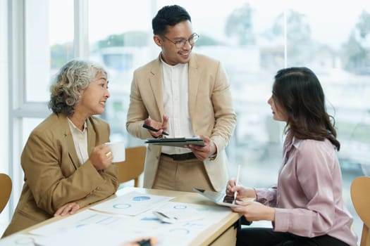 Asian entrepreneurs and business people meeting in a conference room in business planning, financial budget and investment risk assessment to analyze customer groups to increase company growth.