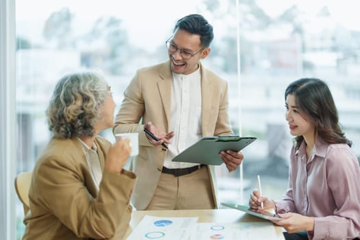 Asian entrepreneurs and business people meeting in a conference room in business planning, financial budget and investment risk assessment to analyze customer groups to increase company growth.