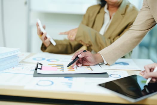 Asian entrepreneurs and business people meeting in a conference room in business planning, financial budget and investment risk assessment to analyze customer groups to increase company growth.