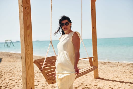 Adult european womanman have vacation and enjoying free time on the beach of sea.