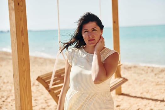 Adult european womanman have vacation and enjoying free time on the beach of sea.