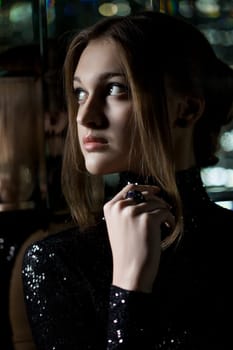 Portrait of pretty young woman in fashion nightclub