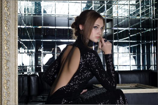 Portrait of beautiful young woman in nightclub