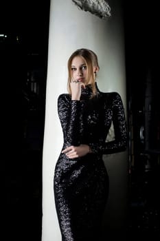 Full length portrait of Pretty young woman in fashion black dress
