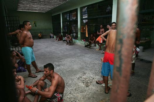 teixeira de freitas, bahia, brazil - november 24, 2009: detainees are seen in jail cells of the police complex in the city of teixeira de freitas.