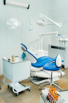 An empty chair in the dentist's office. Empty dentist's office.