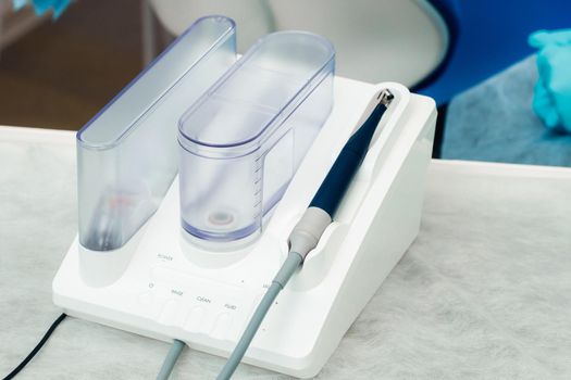 Ultrasonic scaler in the dental office. Dentistry Concept.