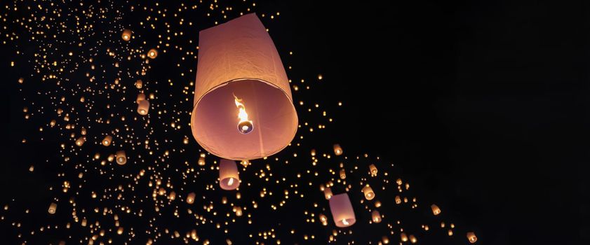 Tourist floating sky lanterns in Loy Krathong festival , Chiang Mai ,Thailand.