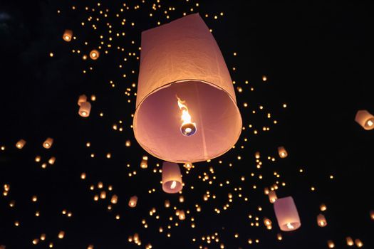 Tourist floating sky lanterns in Loy Krathong festival , Chiang Mai ,Thailand.