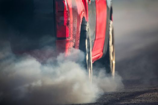 Air pollution from vehicle exhaust pipe on road